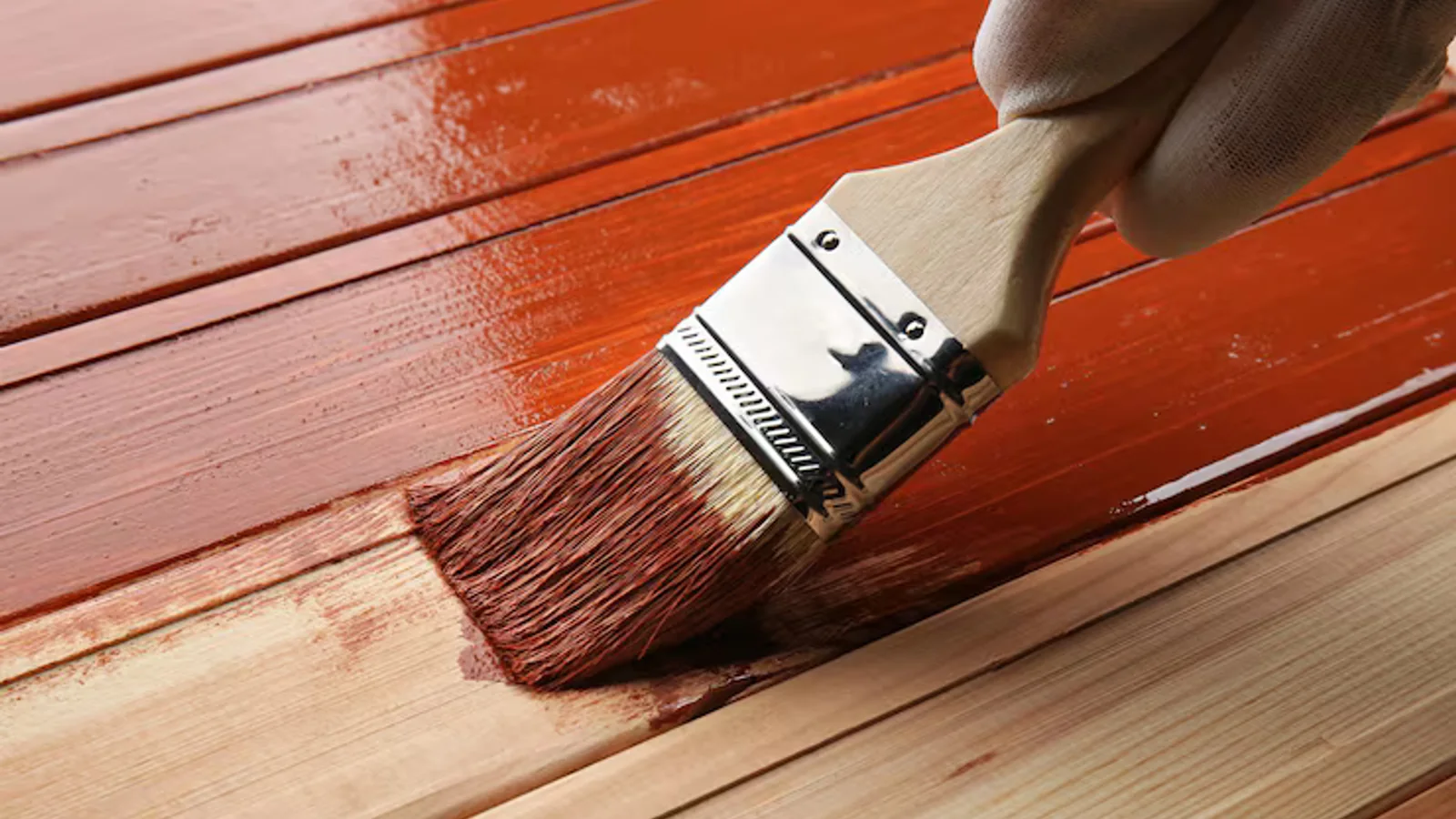 Exterior wood beams and railings coated with fresh protective paint